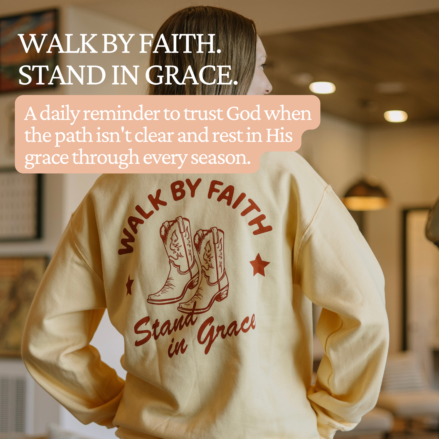 Woman wearing Steadfast & Sustained Walk By Faith Stand In Grace Christian crewneck sweatshirt featuring a faith-inspired message about trusting God through every season.